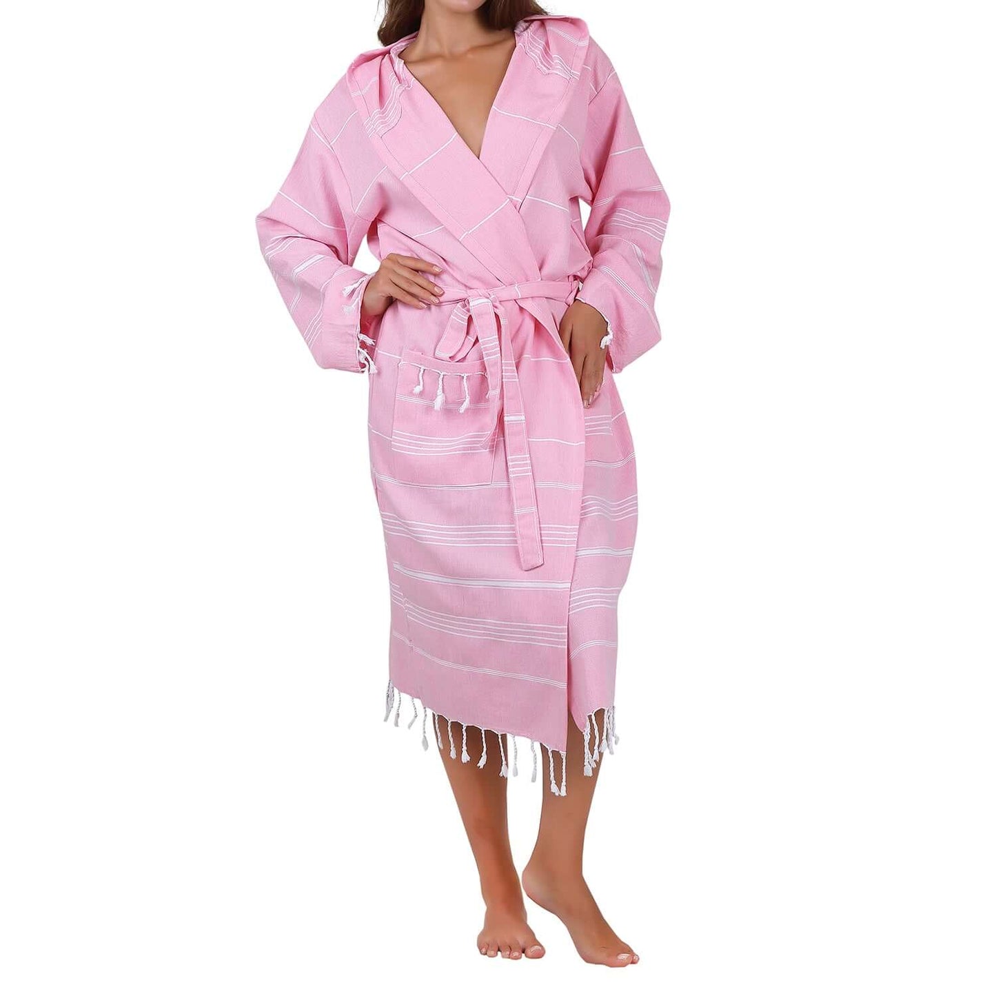 Woman wearing Loom Legacy medium/large pink bathrobe with white stripes and fringe detailing at the bottom.