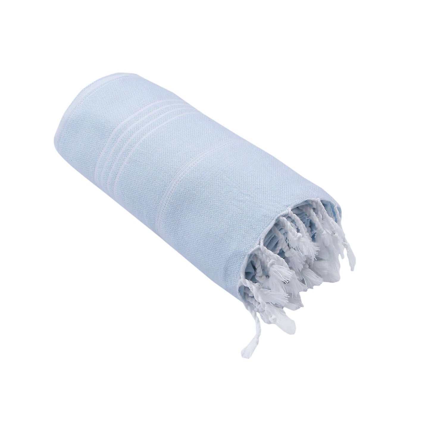 Rolled-up Loom Legacy light blue beach towel with subtle white vertical stripes. One end of the towel showcases fringed white tassels, all presented against a white background.